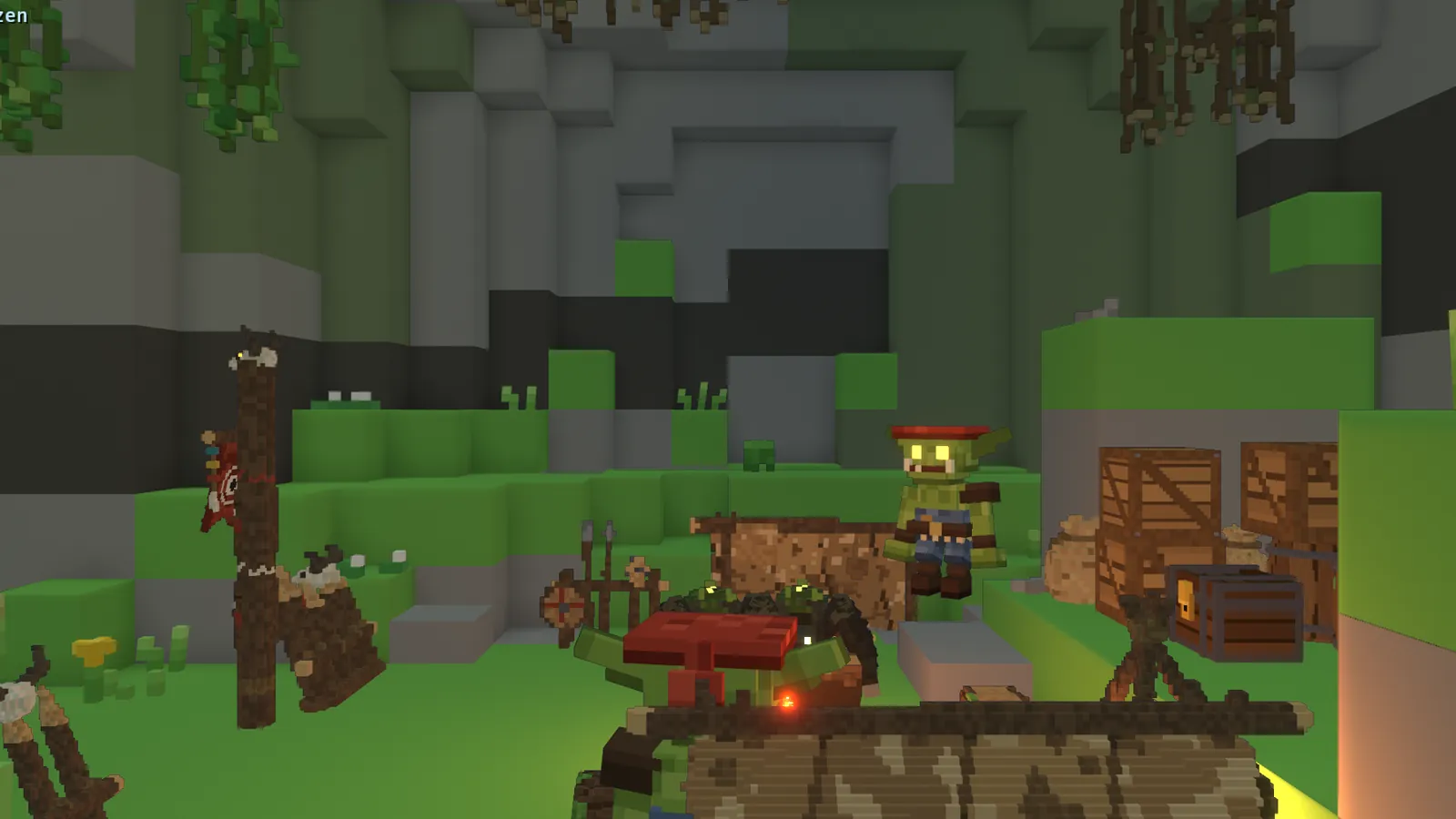 A goblin camp in a mossy cavern, with tents and a catapult