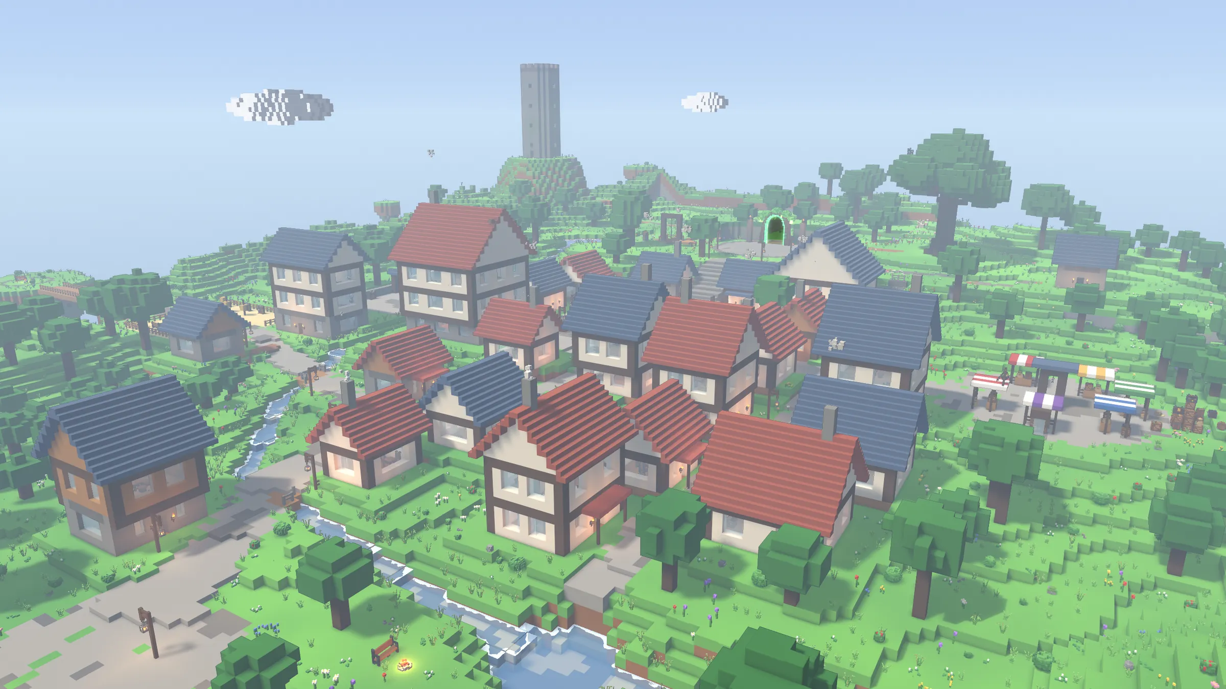 A town of red and slate roofs on a green, hilly island, a stone tower on the hill behind